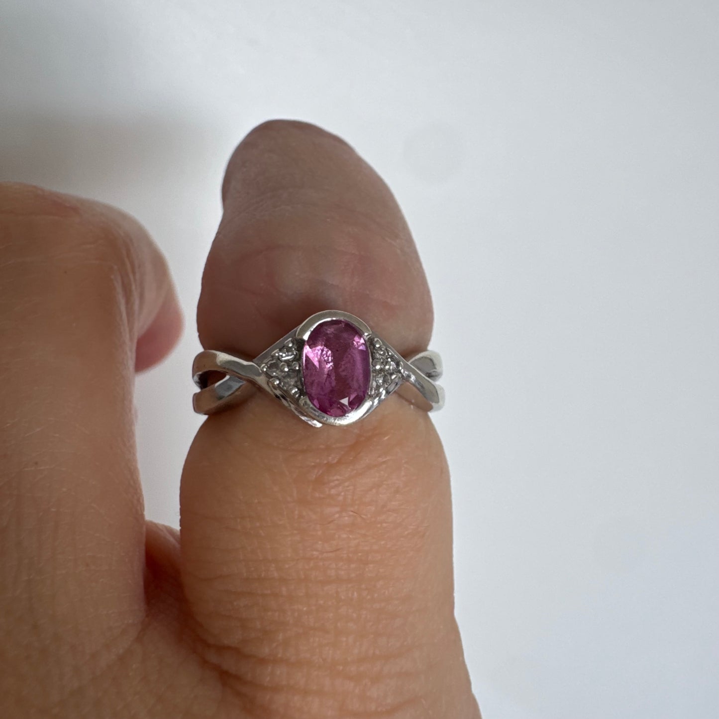 9K gold ring set with a pink center stone