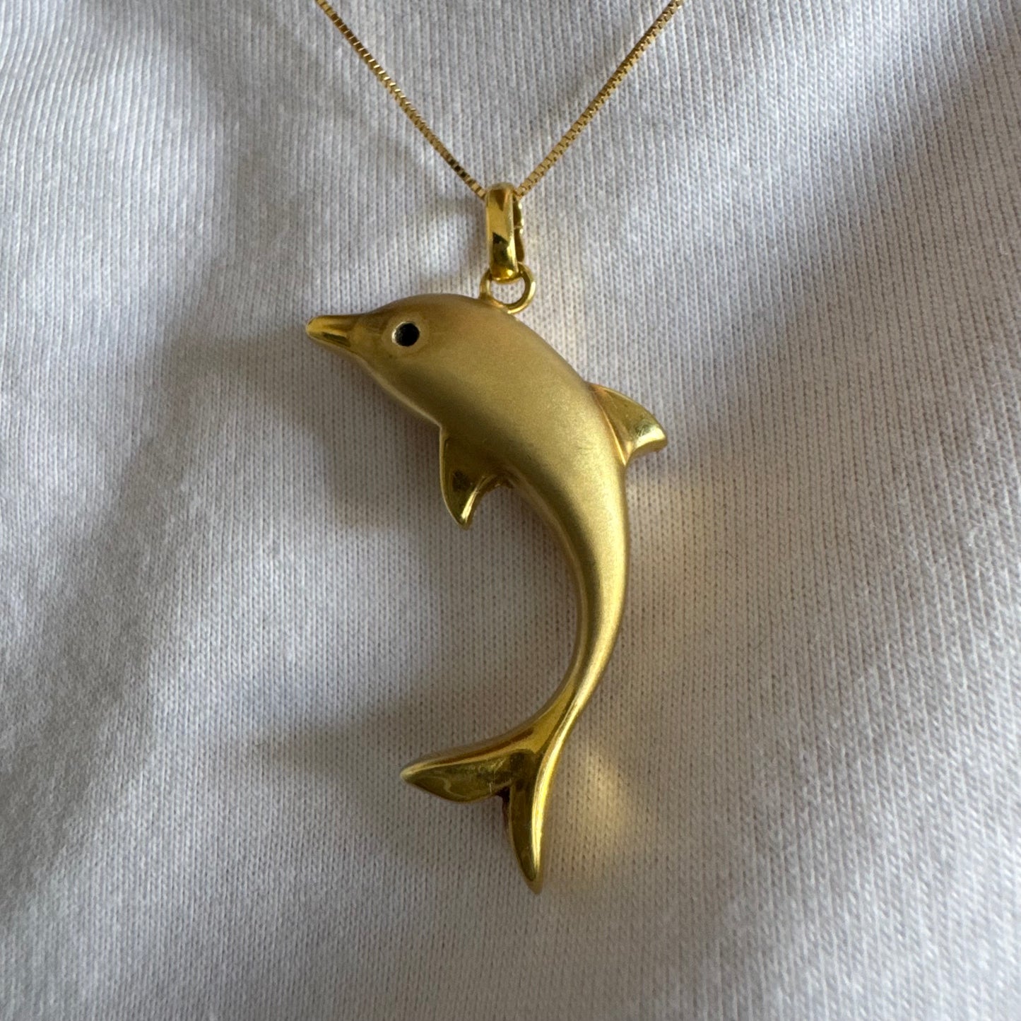 14K gold dolphin pendant with a smooth & polished finish.