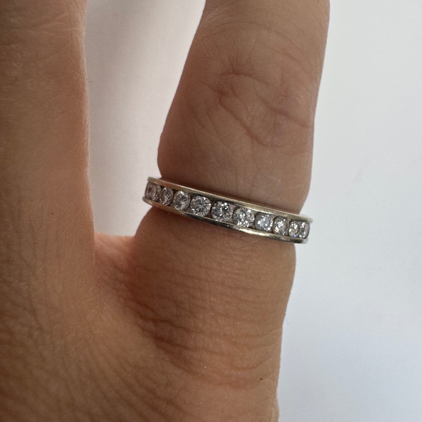 14K white gold eternity ring set with a row of sparkling Diamonds