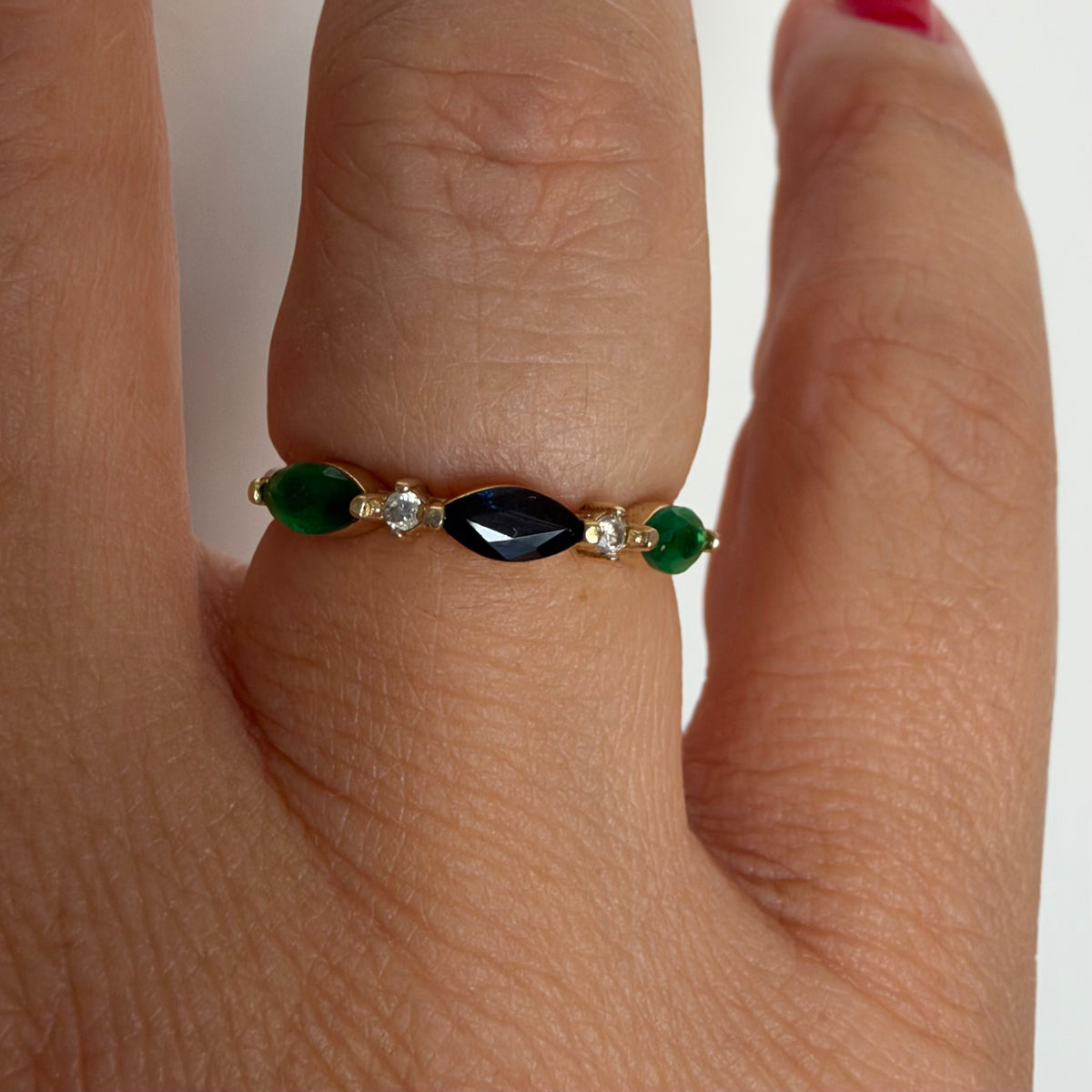 14K yellow gold vintage ring with a marquise-cut sapphire and emeralds