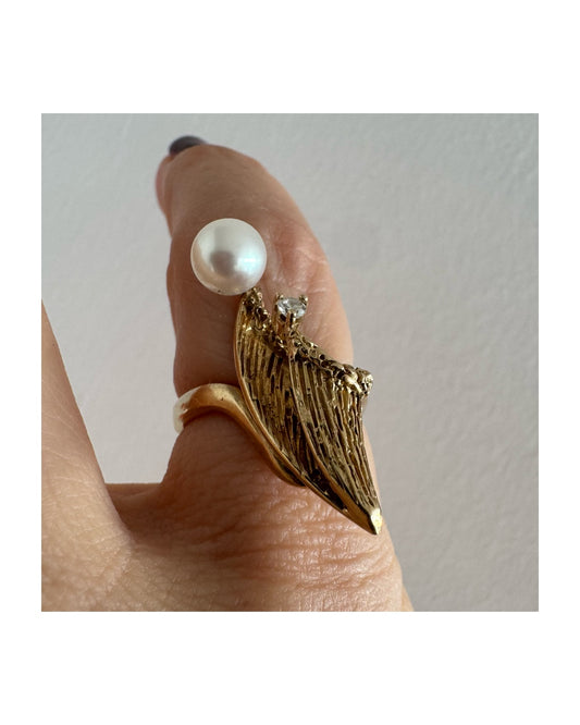 14K gold sculptural ring set with a round Pearl and a delicate Diamond