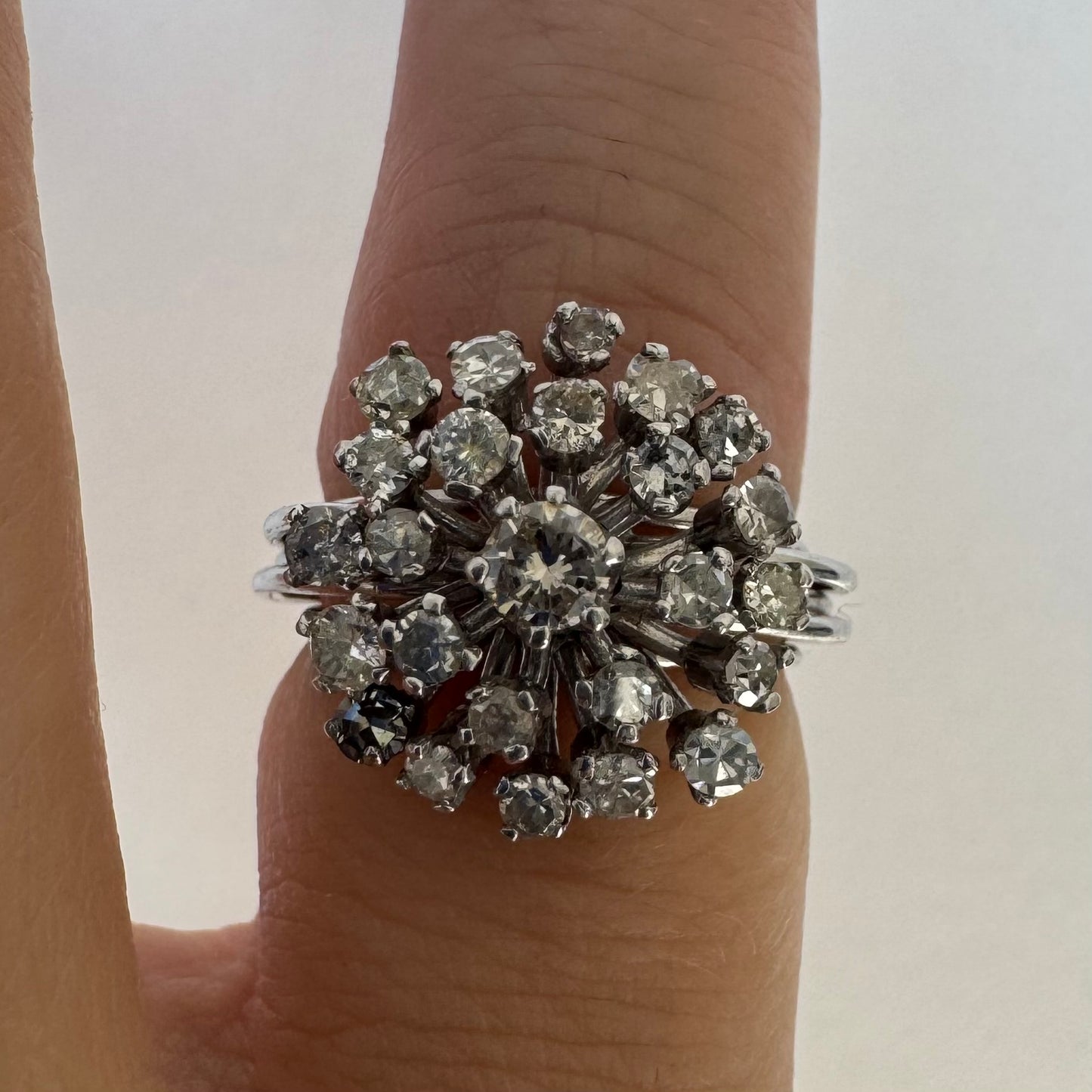 14K gold ring set with a cluster of sparkling Diamonds in a rich floral-inspired design.