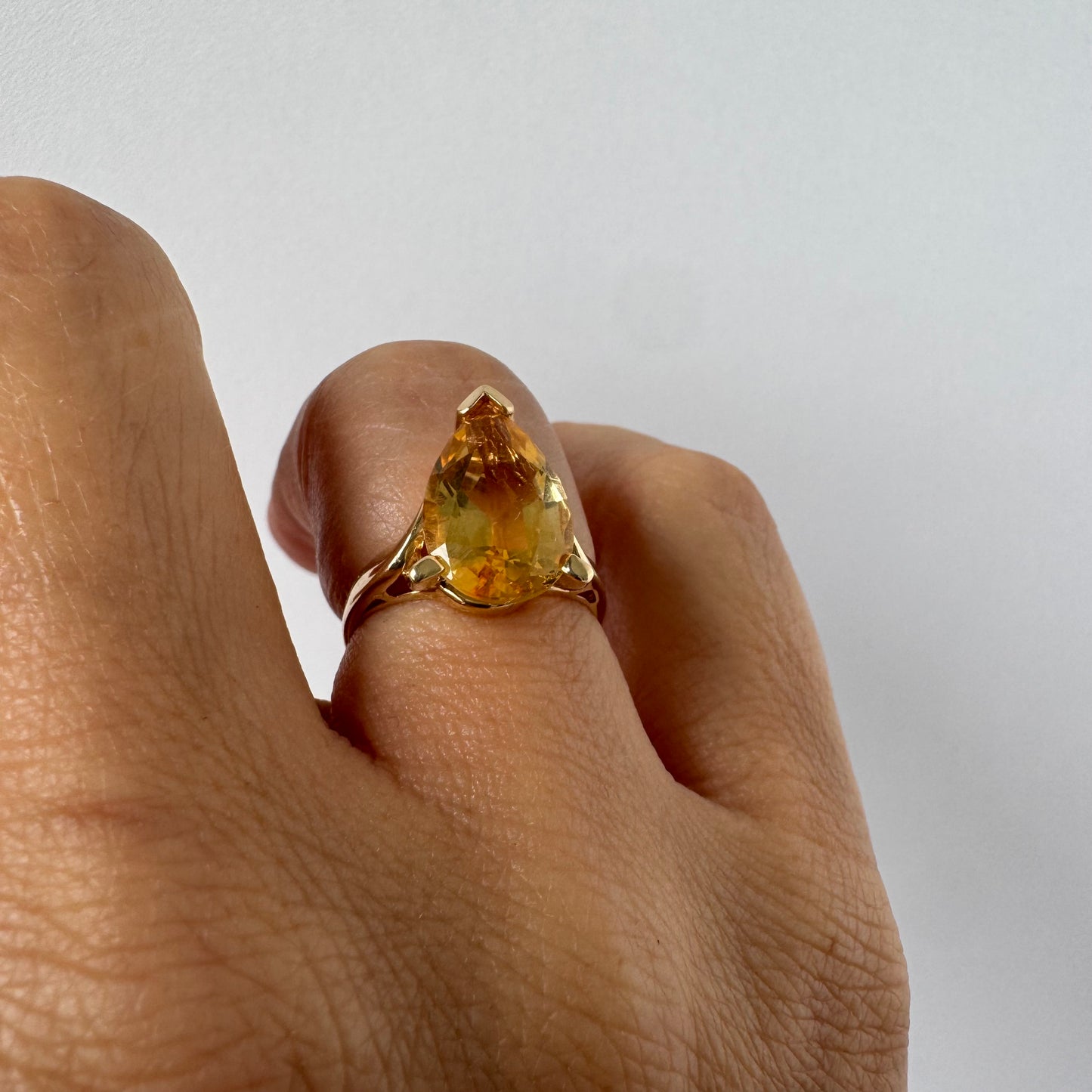 14K gold ring set with a large pear-shaped Citrine