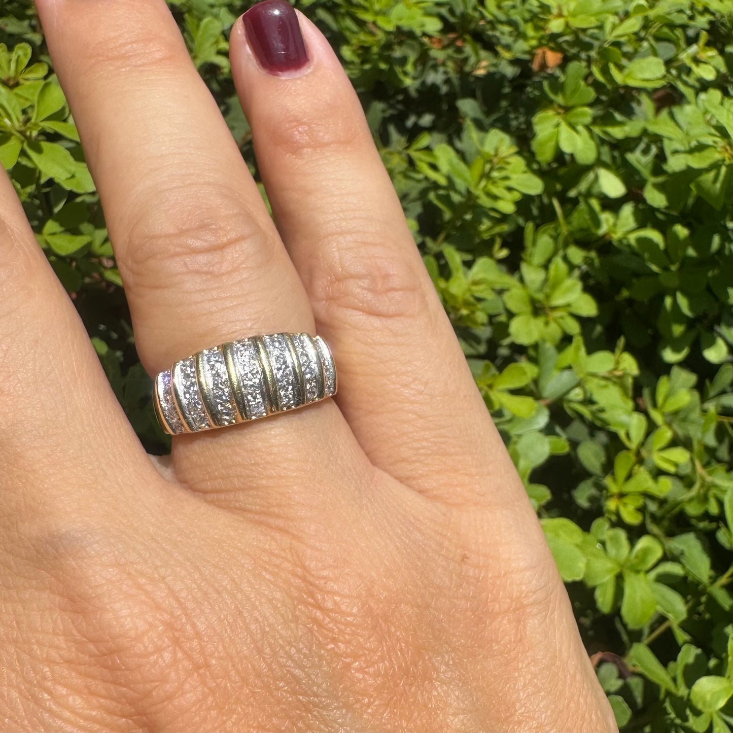 18K gold ring featuring multiple horizontal rows of sparkling Diamonds.