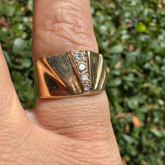 14K gold ring set with Diamonds featuring a fan-like geometric design