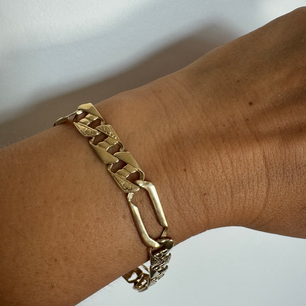 14K gold bracelet with a modern, distinctive link design