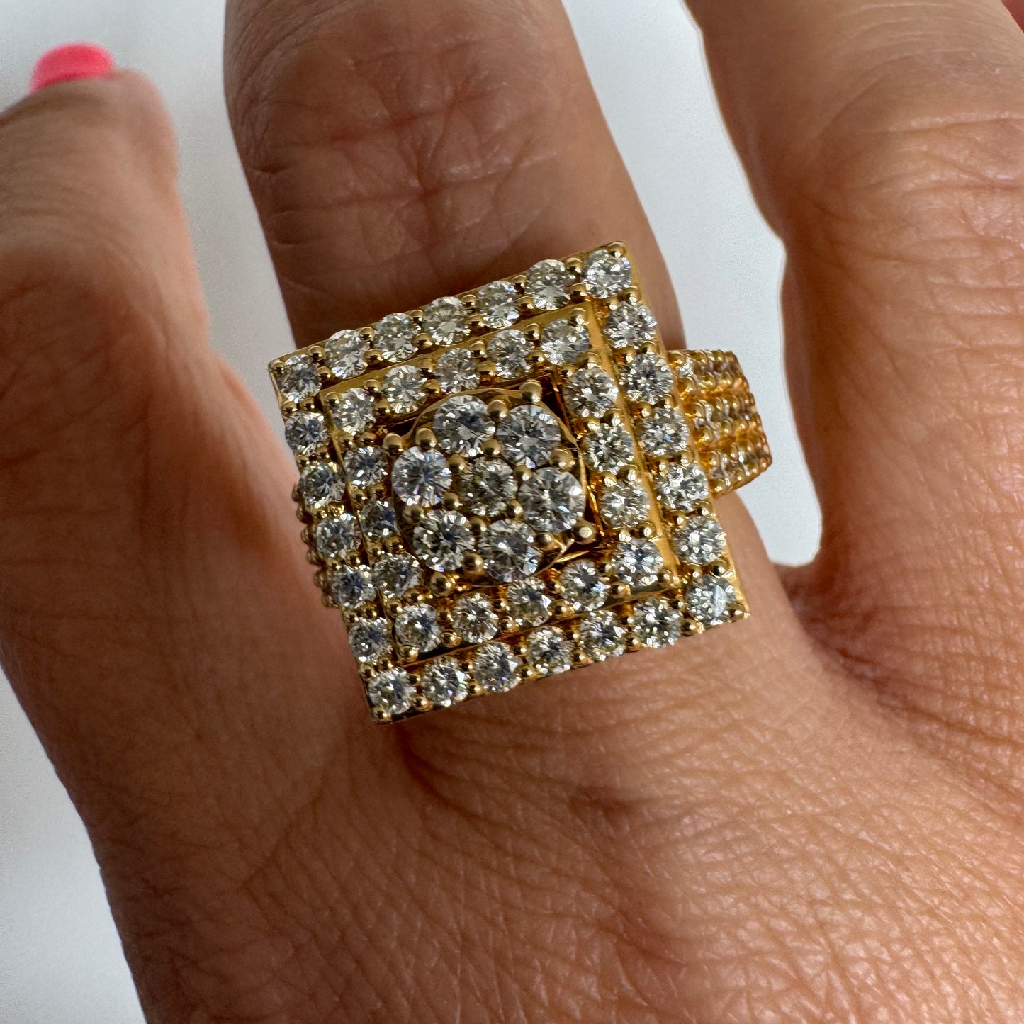 10K gold ring featuring a bold geometric design beautifully set with sparkling Diamonds