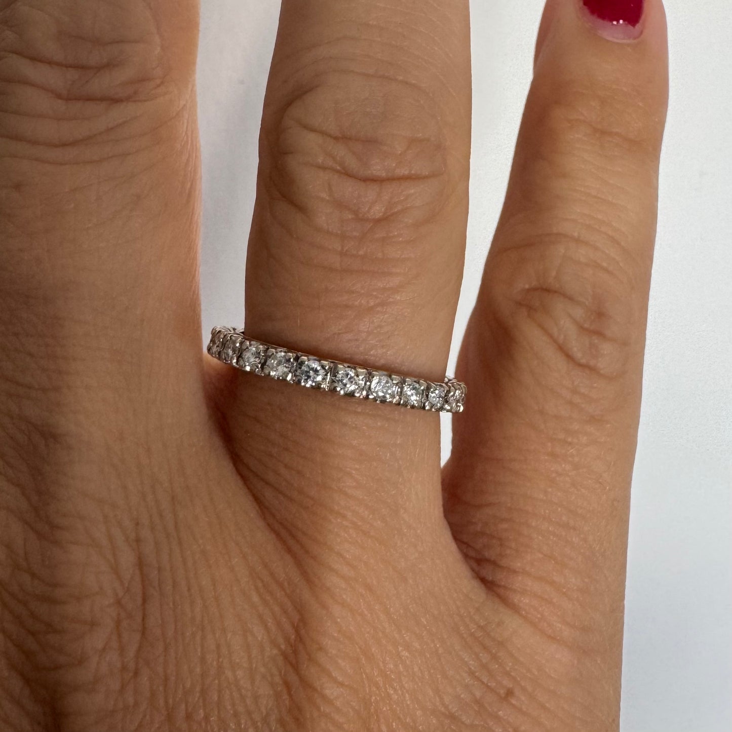 Classic 14K gold eternity ring set with a full circle of sparkling Diamonds