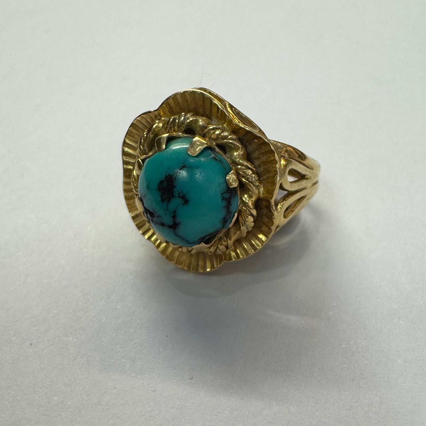 18K gold ring set with a unique Turquoise