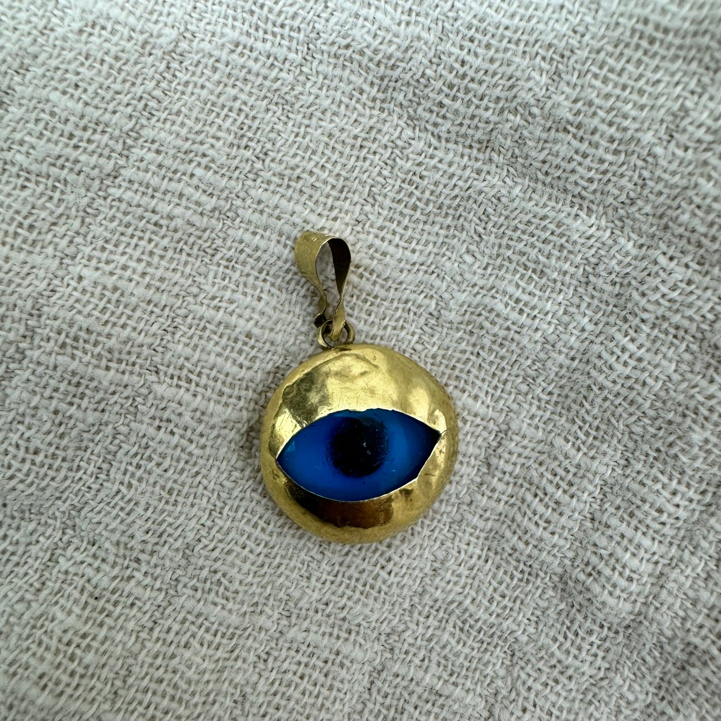 14K gold pendant set with “evil eye”