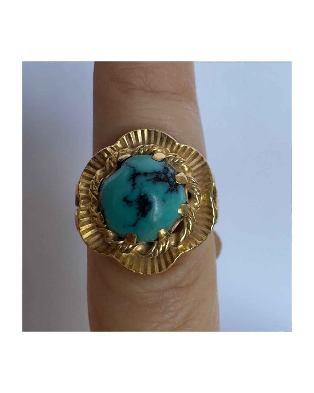 18K gold ring set with a unique Turquoise