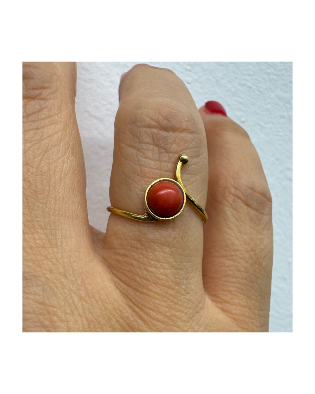 14K gold ring set with a round Coral