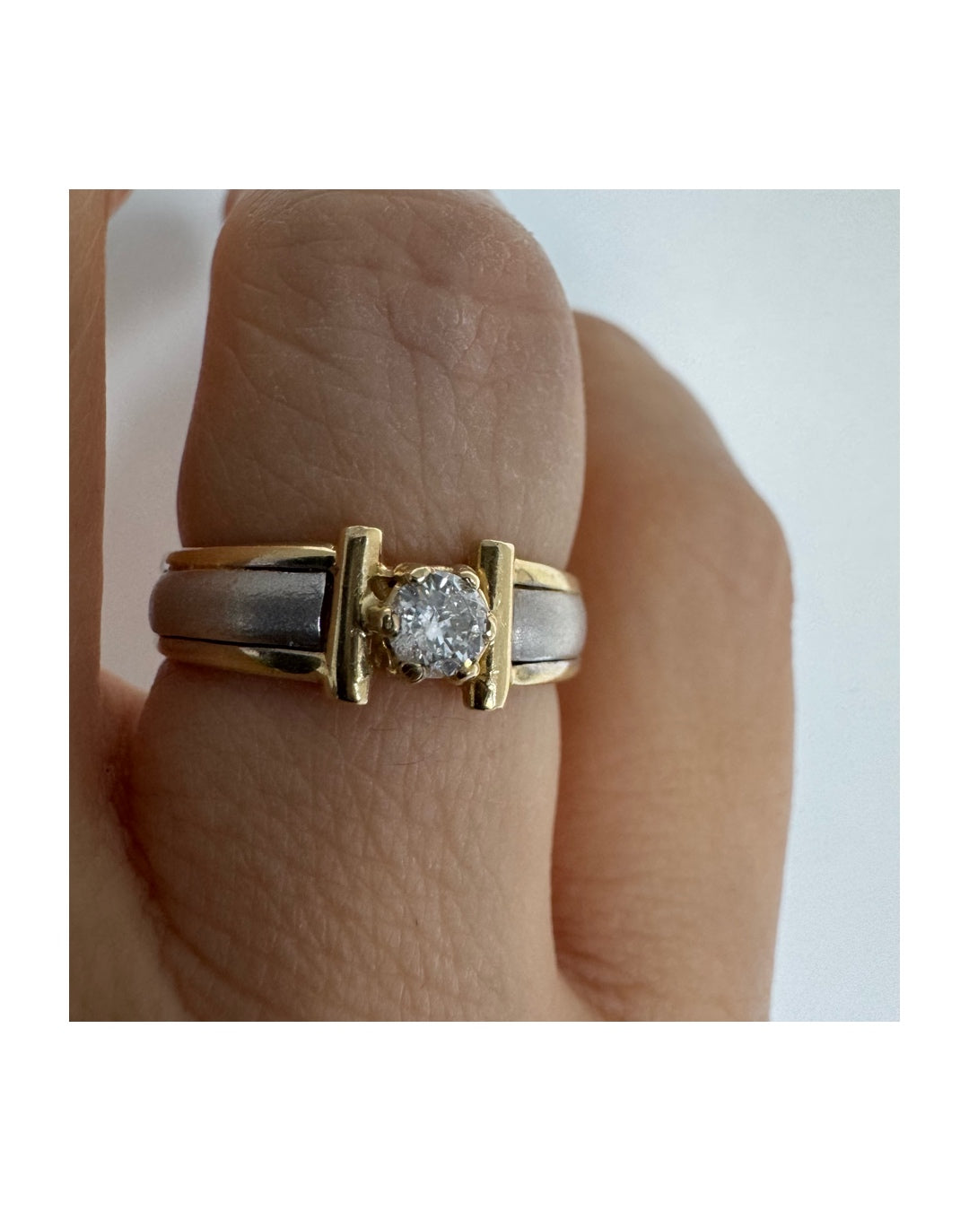 14K two-tone gold ring set with one center Diamond